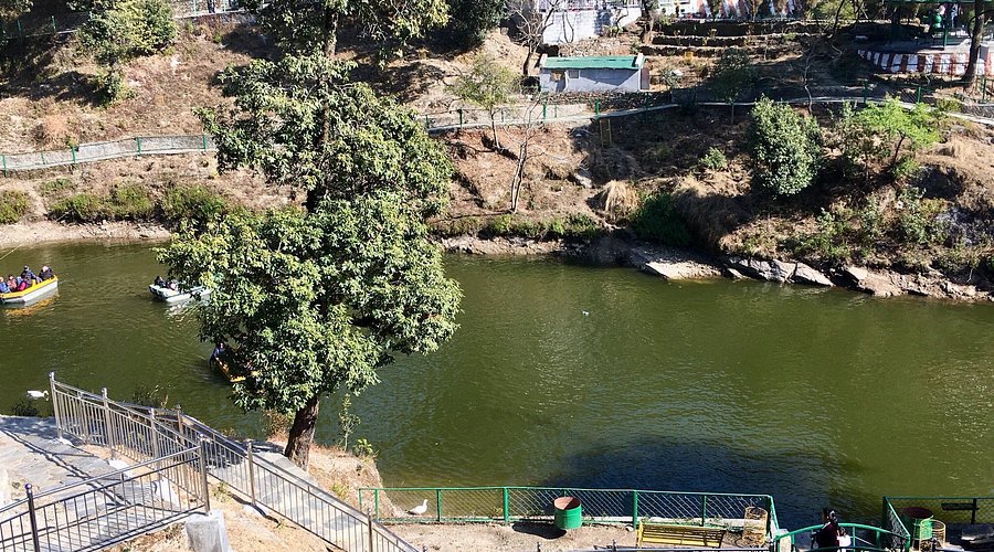 Peaceful Bhulla Lake surrounded by green forests in Lansdowne Uttarakhand