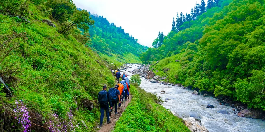 Trekkers walking through remote mountain landscapes on Bali Pass Trek